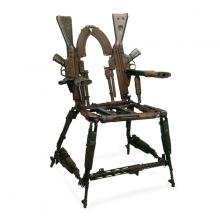 Throne of Weapons a chair made from guns from all over the world