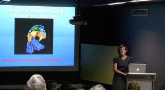 Dr Kate Trinajstic, lecturing in front of a crowd at the WA Museum Dr Kate Trinajstic, Vertebrate Palaeontologist, Curtin University Image copyright WA Museum