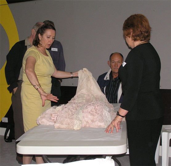 Demonstration of packing costume for storage, preventive conservation technique