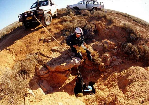 Cave Entrance Two scientists preparing to abseil into the cave opening